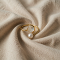 Offene Duo Perle Wickelring mit funkelnden Augen