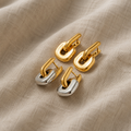 Minimalistische zweifarbige goldene Ohrringe, oval