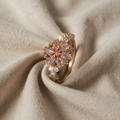 ROSA UND GOLDENE GLITZER-RING mit Blumenmuster