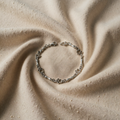 Begrenzte Auflage Silberarmband mit Hundepfoten und Knochen