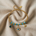 Ula – Armband mit blauem Auge und Anhängern